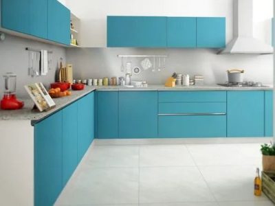 Modern L-shaped kitchen design in blue and white, featuring high-quality materials and stylish finishes