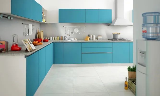 Modern L-shaped kitchen design in blue and white, featuring high-quality materials and stylish finishes