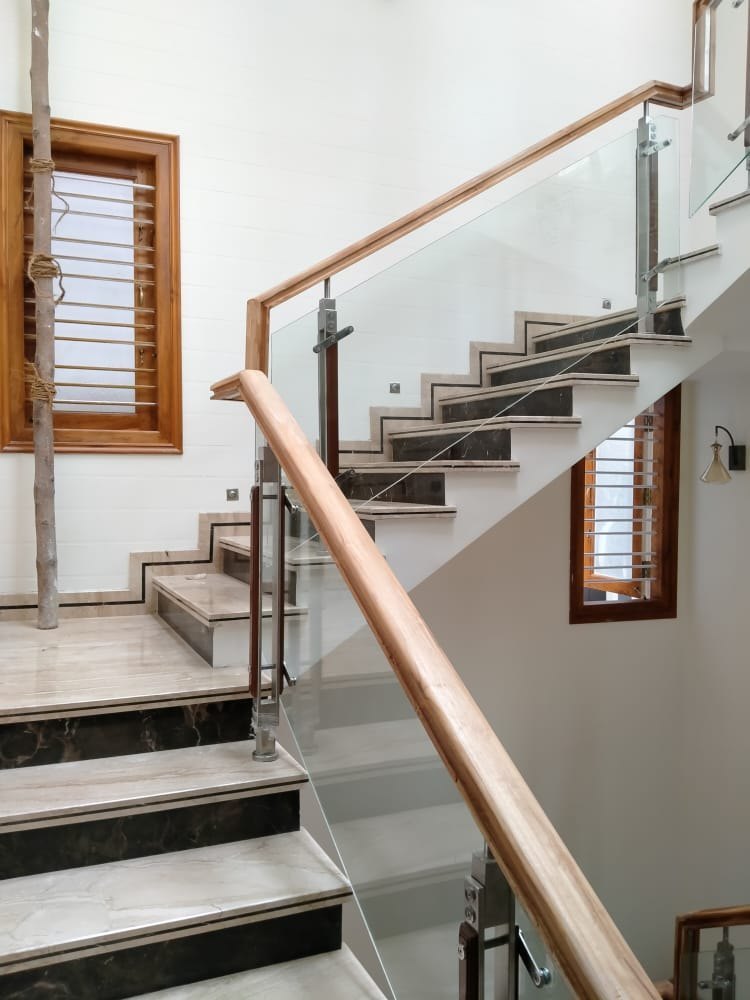 Elegant wooden and glass railing designs, featuring modern and sophisticated elements.