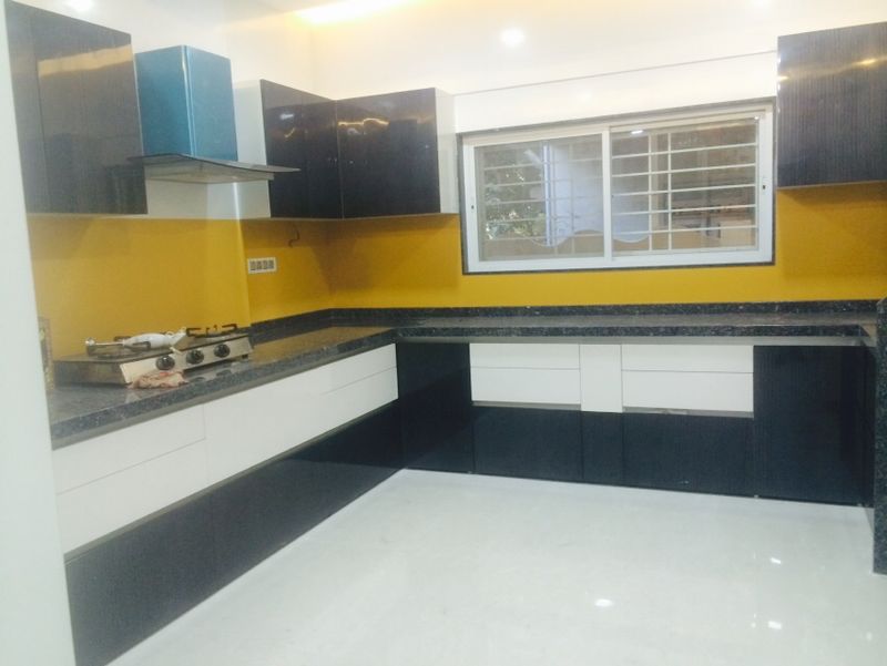 Modern black and white kitchen design with sleek cabinetry and clean lines.