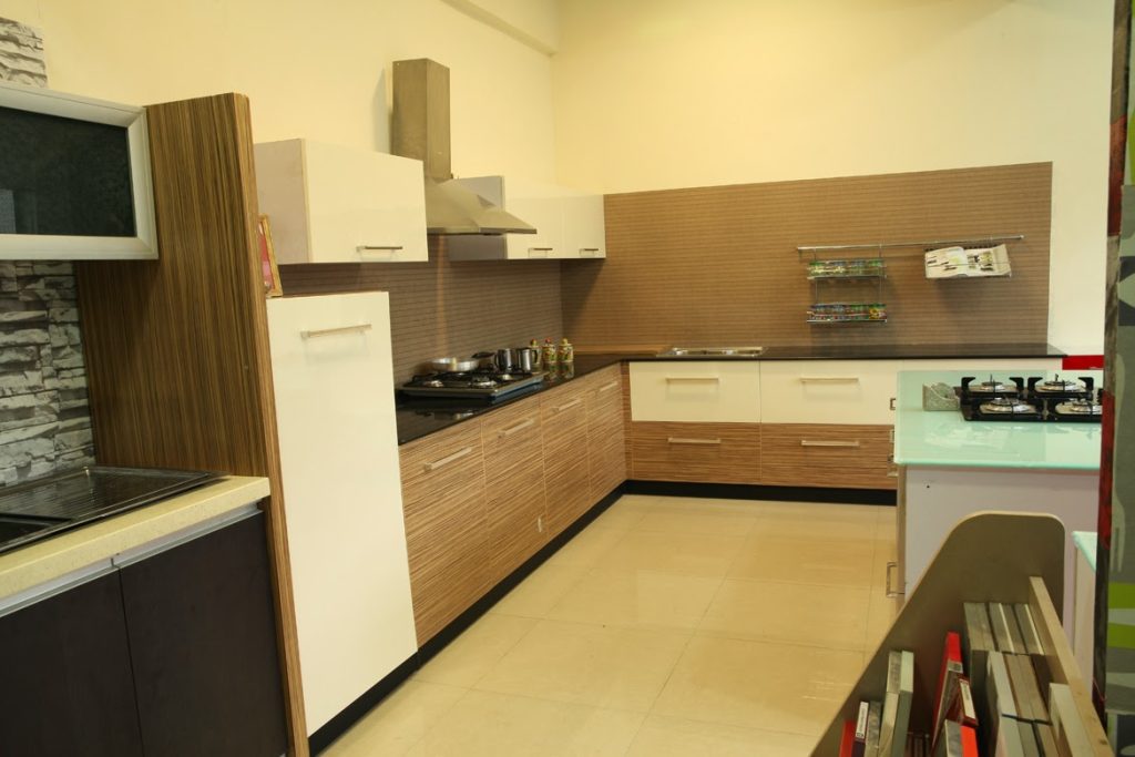 Modern modular kitchen design with sleek cabinets and organized layout.