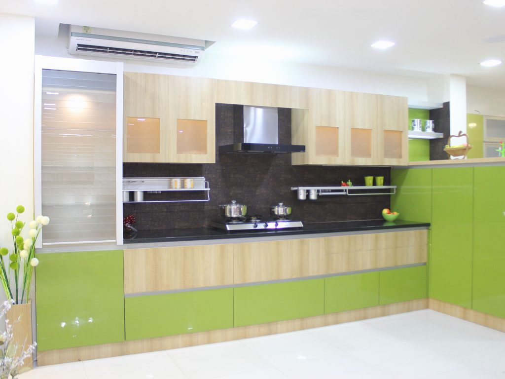 Modern kitchen interior with sleek cabinets, contemporary lighting, and a functional island.