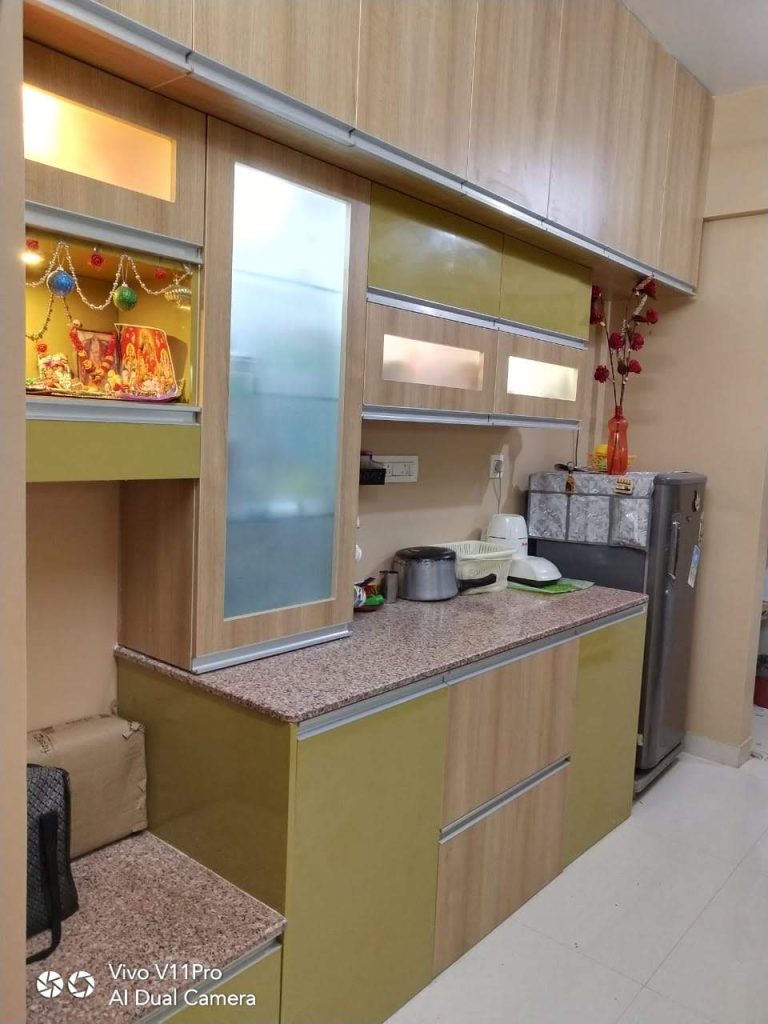 Modern green color small modular kitchen interior in Camp, designed for functionality and style.