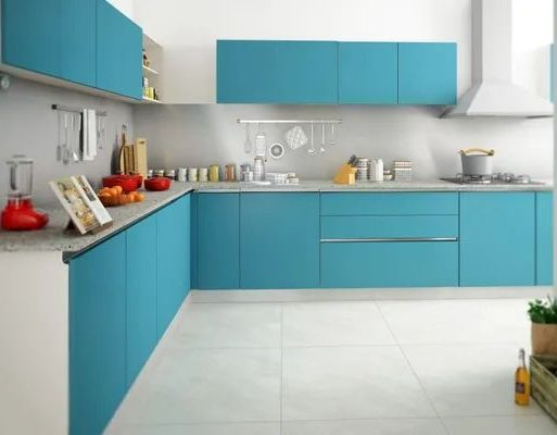 Elegant blue L-shape modular kitchen with modern cabinetry and sleek appliances.