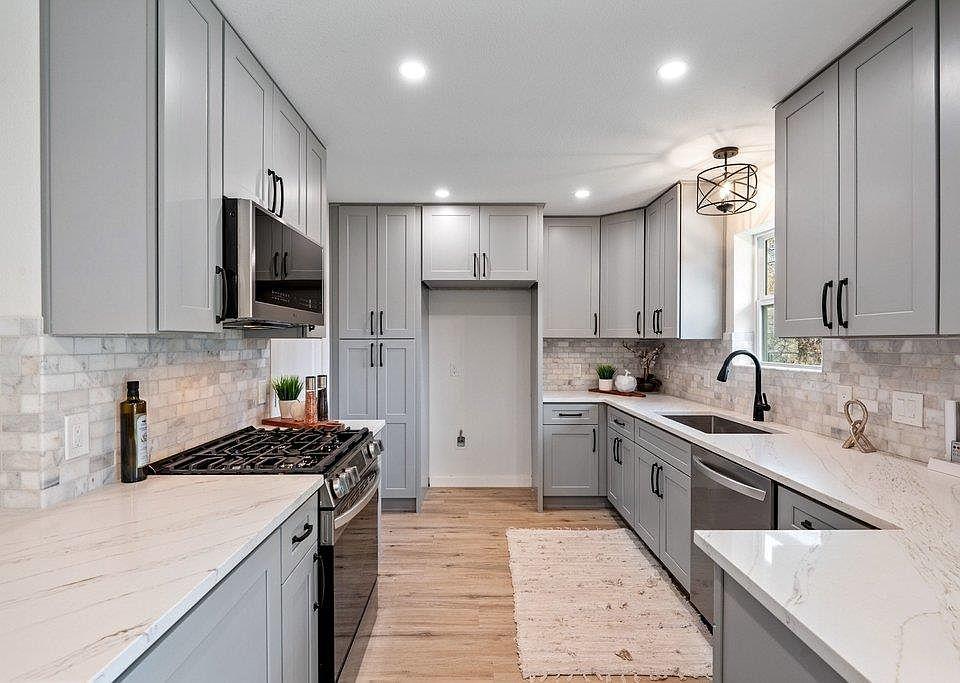 Grey and white modular kitchen cabinets