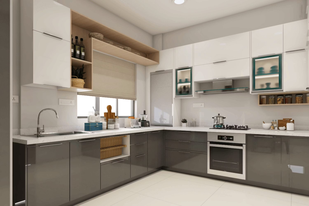 U-shaped kitchen with white upper cabinets, dark base cabinets, and stainless steel sink under a window.