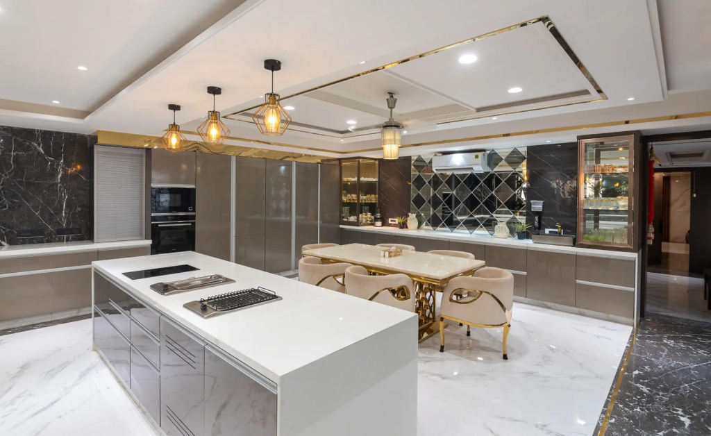 Luxurious open-plan kitchen with white island, gas cooktop, and beige dining chairs